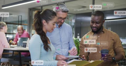 Team Collaborating on Social Media Data Analysis in Modern Office