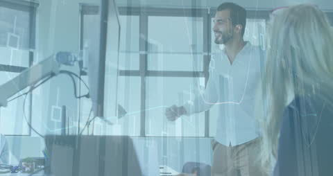 Diverse Business People Analyzing Financial Data on Computers