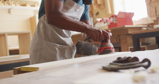 Skilled Craftsman Sanding Wood in Workshop - Download Free Stock Images Pikwizard.com