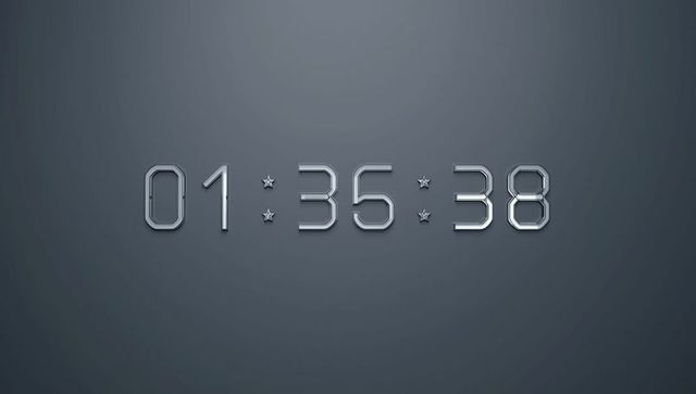 Futuristic metallic digital clock display on dark background