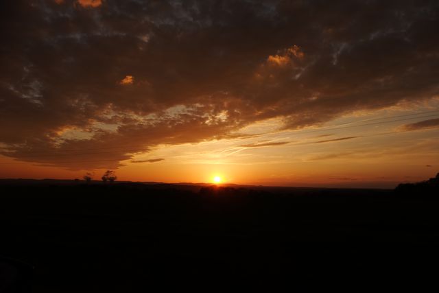 Stunning Sunset with Orange and Purple Sky Over Horizon - Download Free Stock Photos Pikwizard.com