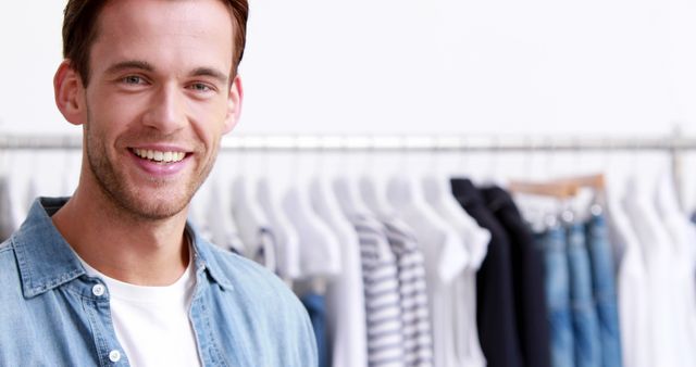 Cheerful Young Man Shopping in Clothing Store - Download Free Stock Images Pikwizard.com