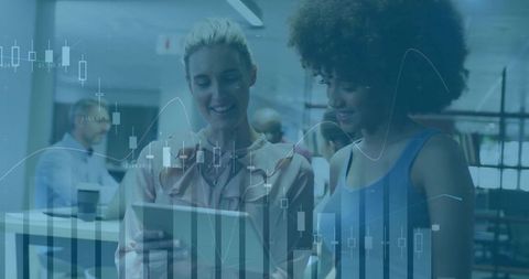 Colleagues Analyzing Data on Tablet in Modern Office Setting