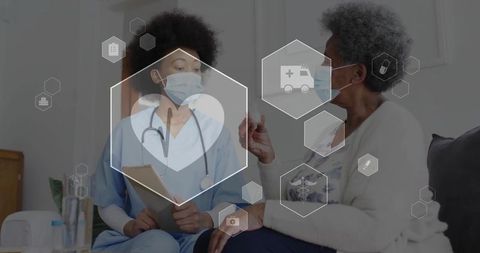 Nurse visiting senior discussing health care on digital interface