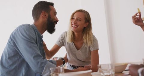 Couple sharing a joyful moment relaxing over the weekend