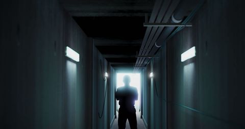 Silhouette in Dark Corridor for Eerie Atmosphere - Download Free Stock Images Pikwizard.com