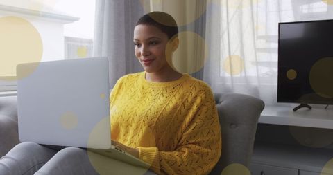 Happy Woman Using Laptop at Home
