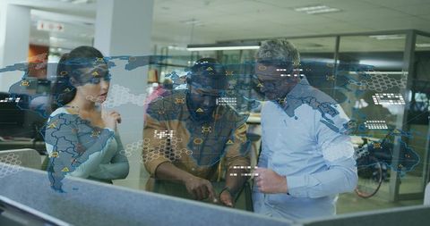 Business Professionals Collaborating on Transparent Digital Map in Modern Office