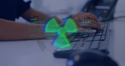 Technology interface with green hazard cybersecurity alert overlay