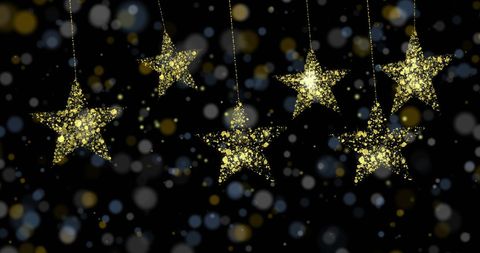 Golden Stars with Sparkling Spots on Black Background