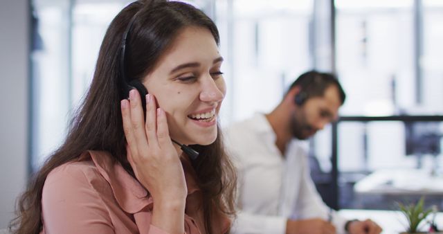 Smiling Female Call Center Operator Talking to Client in Office - Download Free Stock Images Pikwizard.com