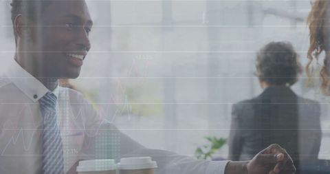 Businessman Collaborating with Financial Data Overlay in Modern Office - Download Free Stock Images Pikwizard.com