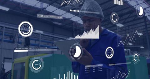 Factory technician reviewing ar dashboards on tablet for equipment monitoring