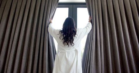 Teenage Girl Drawing Curtains in Morning Sunlight - Download Free Stock Images Pikwizard.com