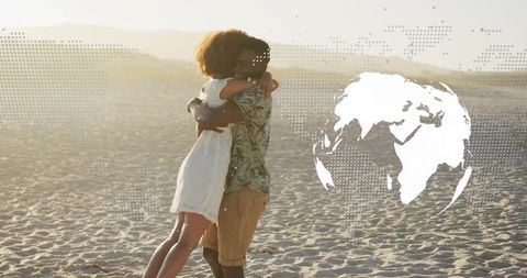 Couple Embracing on Sandy Dune with Globe Overlay
