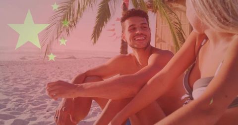 Smiling young couple relaxing on tropical beach under palm trees with star flag overlay