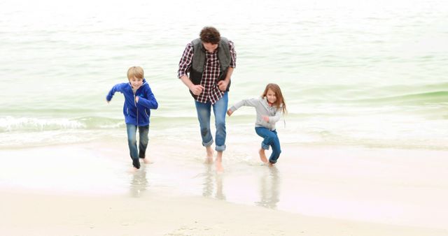 Father Enjoying a Day at the Beach with His Two Children - Download Free Stock Images Pikwizard.com