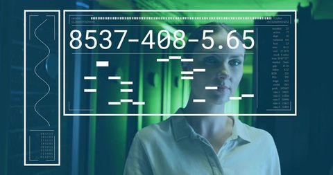 Female technologist analyzing data interface in modern data center