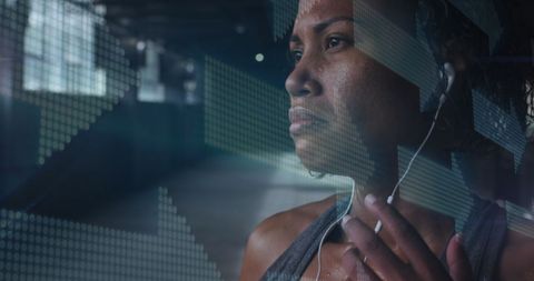 Focused African American Woman Listening to Music at Gym