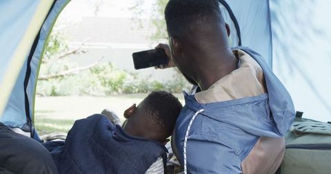 Father and Son Bonding in Backyard Tent Camping Experience