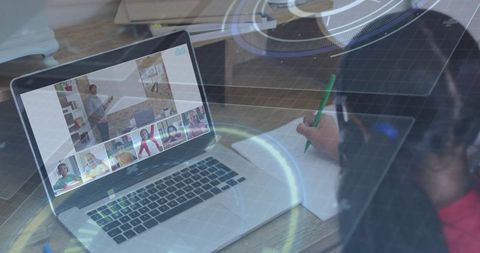 Girl engaging in online class with laptop at home