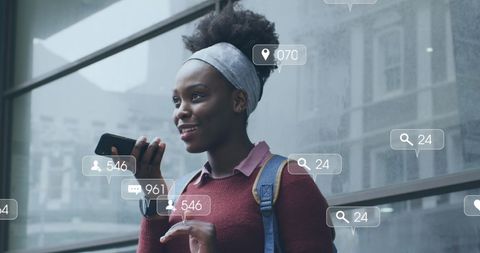 Young Woman Engaging with Social Media on Smartphone in Urban Setting