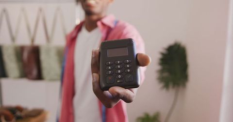 Small Business Owner Showing Card Reader in Workshop - Download Free Stock Images Pikwizard.com