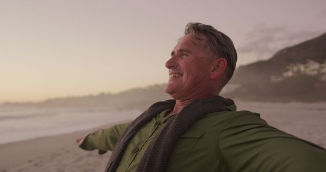 Happy Senior Man Enjoying Sunset at Beach - Download Free Stock Images Pikwizard.com