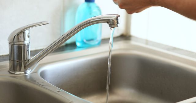 Person Washing Hands Under Kitchen Sink Faucet - Download Free Stock Images Pikwizard.com