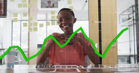 Smiling Professional with Data Graph Overlay in Modern Office