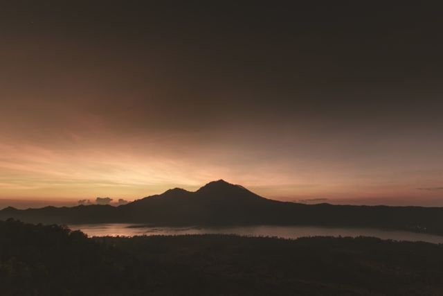 Dramatic Sunrise over Serene Mountain Range with Silhouette Effect - Download Free Stock Images Pikwizard.com