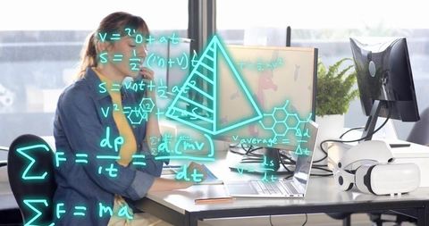 Woman analyzing data on laptop with vr headset and augmented math overlays in office