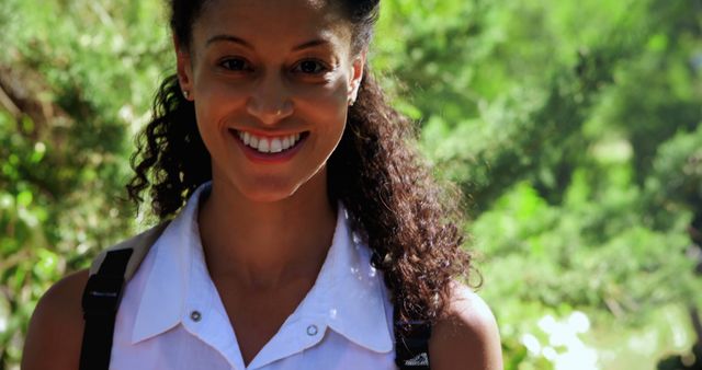 Smiling Woman With Backpack in Nature - Download Free Stock Images Pikwizard.com