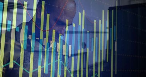 Businessman analyzing animated data graphs in modern office