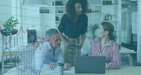 Business Team Analyzing Financial Data on Projected Screen