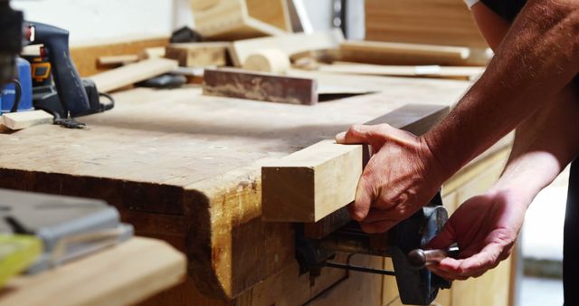 Carpenter Cutting Wood at Workbench in Workshop - Download Free Stock Images Pikwizard.com