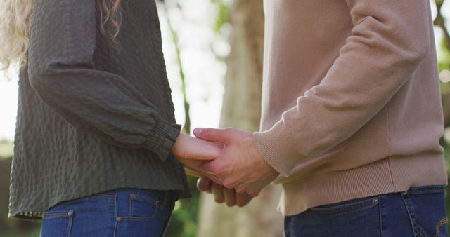Image of happy caucasian husband and wife holding hands and touching heads in garden - Download Free Stock Photos Pikwizard.com