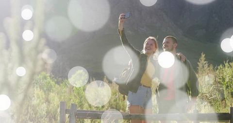 Couple Taking a Selfie on Scenic Mountain Adventure