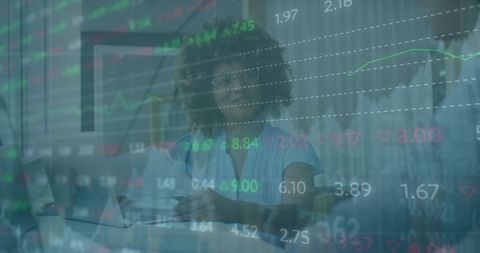 Businesswoman Analyzing Data with Stock Market Graph Overlay