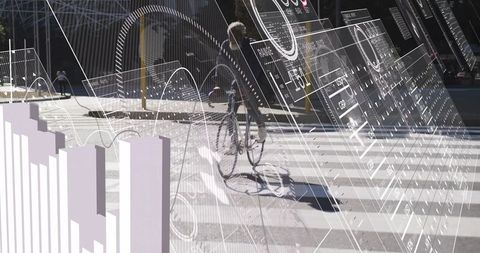 Cyclist Riding Urban Street with Futuristic Data Overlay