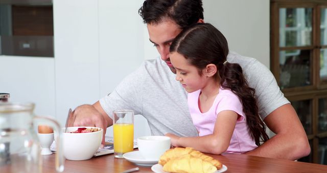 Father and Daughter Having Breakfast at Table - Download Free Stock Images Pikwizard.com