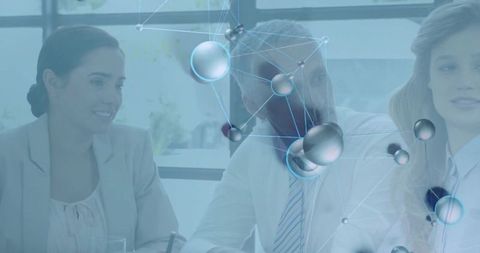 Business Team Analyzing Reports with Digital Network Overlay