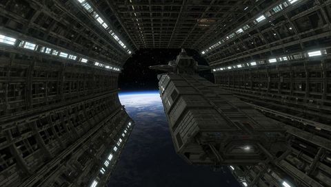 Massive cargo freighter extending into cylindrical orbital docking bay with earth horizon