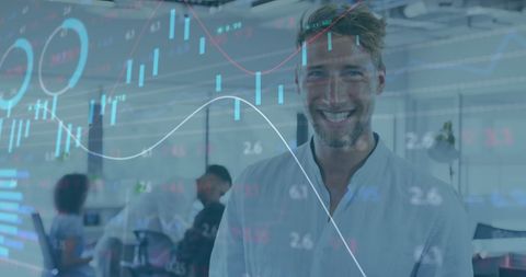 Smiling Businessman with Digital Charts in Modern Office
