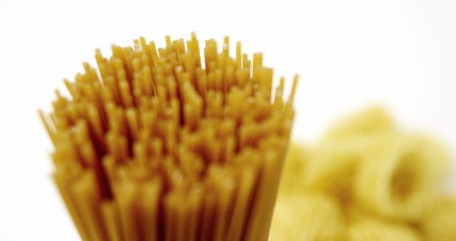 Close-Up of Uncooked Spaghetti with Blurred Pasta Background - Download Free Stock Images Pikwizard.com