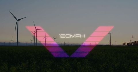 Wind turbines at dusk with tech overlay and speed metrics