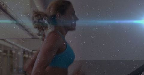 Woman Running on Treadmill with Blue Lens Flare for Fitness Motivation