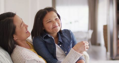 Happy Mother and Daughter Enjoying Quality Time at Home