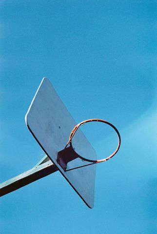 Outdoor Basketball Hoop with Clear Blue Sky Background