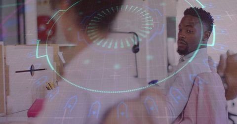 Businessman glancing in tech infused office environment